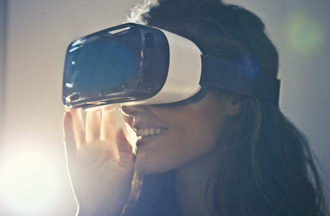 photo – a closeup of a woman wearing a VR headset