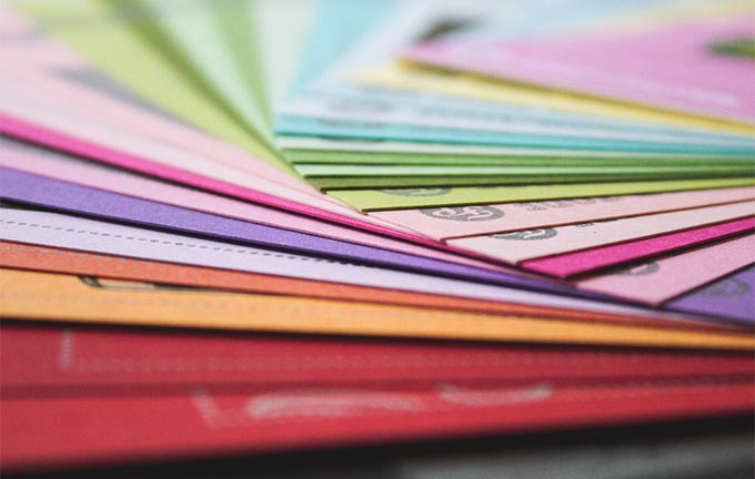 photo - closeup of colorful paperwork spread across a table